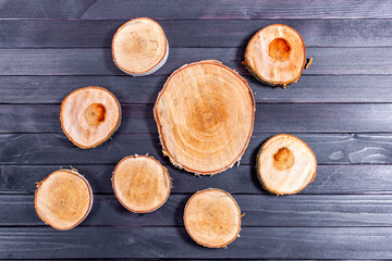 Wooden stump with happy new year decoration. Round cut down tree with annual rings as a wood texture.