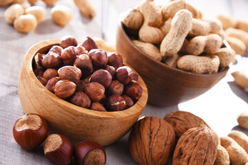 Composition with two bowls of hazelnuts and peanuts