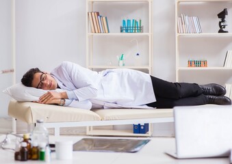 Doctor relaxing after complex surgery in hospital