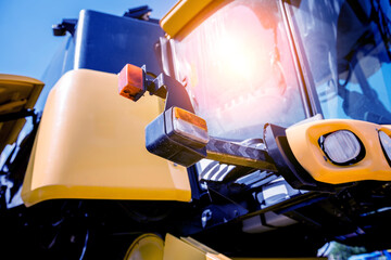 Fototapeta premium Modern agricultural machinery and equipment. Yellow agricultural harvester.