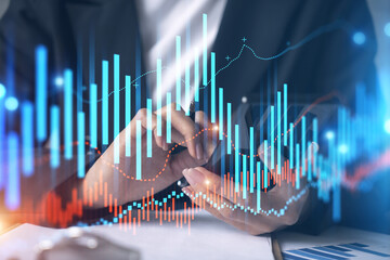 Businesswoman using smart phone in office. Forex chart hologram. On-line trading stock market concept. Double exposure.
