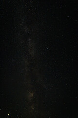  milky way starry sky over a forest in a Russian village