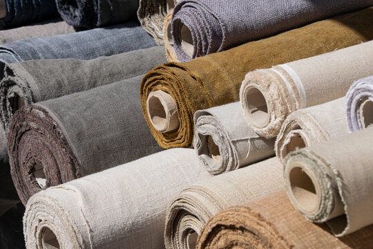Rolls of linen canvas textile on market stall