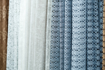 Curtains for windows, tulle with mesh texture in the apartment