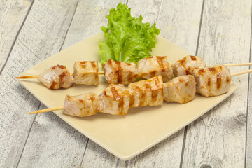 Grilled pork skewer served salad