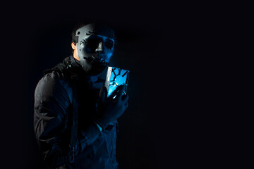 hacker robbery terrorist holding the harddisk of virus computer attack to server network system...