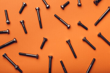 Fototapeta premium Bolts closeup on orange background.