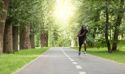 Black man jogger training at park, getting ready for marathon