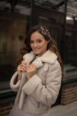 Beautiful bride in a long dress, hair accessories, wedding makeup