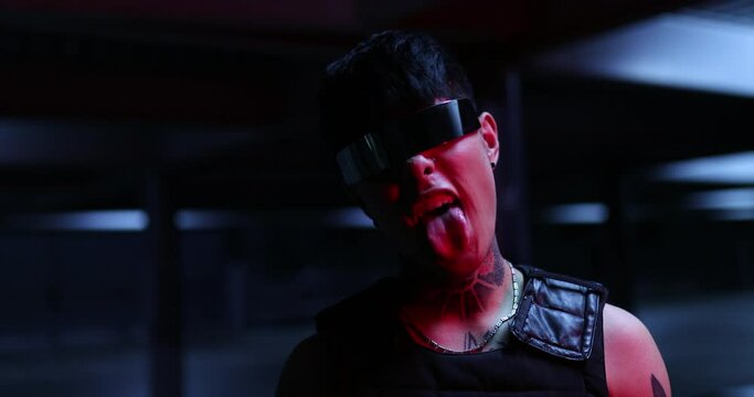 Cyberpunk style. Aggressive guy shows emotions. Night city