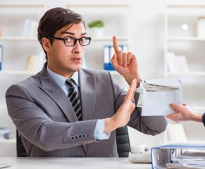 Businessmanbeing offered bribe for breaking law