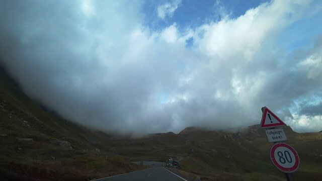 Foggy morning on the Grossglockner mountain road in Austria in autumn.