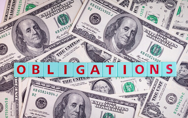 Obligations word on a dollars background, business concept.