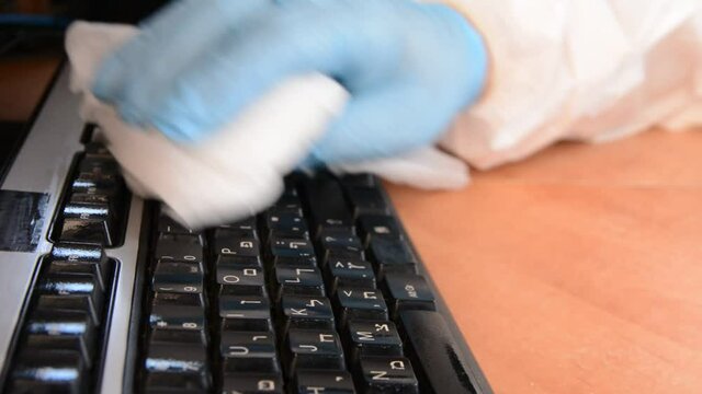 worker in bacteriological protection suit at work