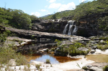Fototapeta na wymiar Waterfall in Rio Preto State Park in Minas Gerais at Cachoeira da Semper-Viva (translate to Always-Alive Waterfall, with is the popular name of Actinocephalus polyanthus)