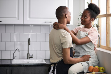 beautiful young couple have rest in the kitchen, enjoy cooking together, free time at home, in love