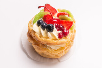 Home made cake with cream and fruits isolated.