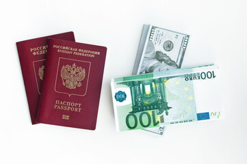 Two foreign passports of the Russian Federation, a pack of notes of 100 dollars and euros