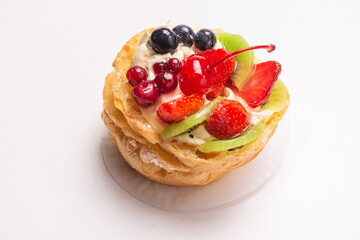 Home made cake with cream and fruits isolated.