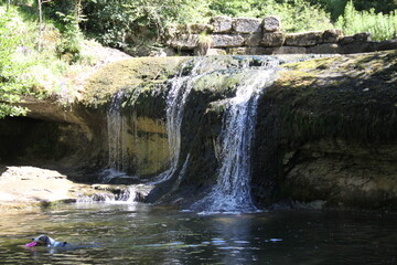 Fototapeta na wymiar Summer beautiful waterfall fresh nature landscape