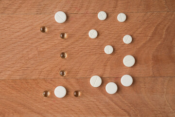 Number nineteen laid out from tablets of various shapes on a wooden board background