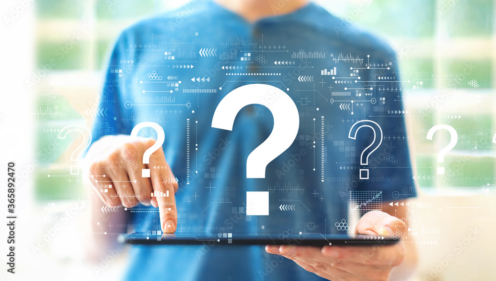 Poster question marks with young man using a tablet computer