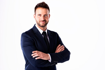 Handsome businessman wearing suit while standing at isolated white background