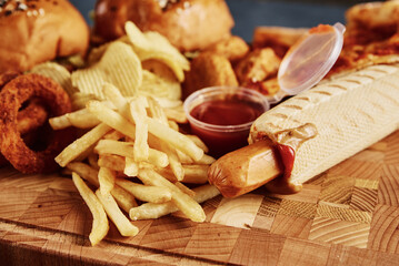 Unhealthy and junk food. Different types of fast food on the table, closeup