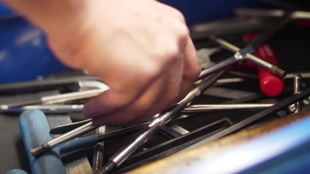 taking tool and close drawer rom storage workbench slow motion