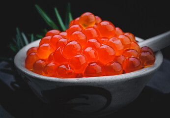 Salmon roe group with black background.