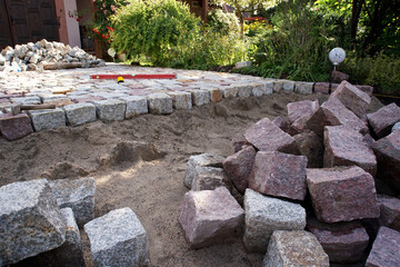 backyard with granite paving stones under construction
