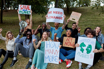 group of african caucasian activists chanting slogans for environment protection, stop plastic...