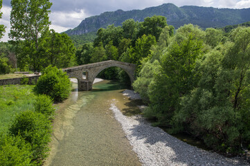 Fototapeta na wymiar Stone bridge of Portitsa and Ziaka in Epirus mountains near Grevena in Greece
