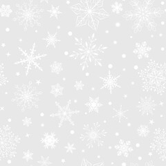 Christmas seamless pattern with various complex big and small snowflakes, white on gray background