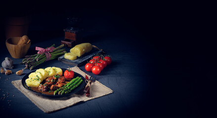 dumplings with beef goulash and green asparagus