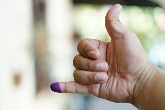 Finger marked with blue ink. Indonesian presidential election