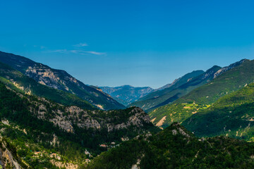 A picturesque landscape view of the French Alps mountains and the valley of river Var (Puget-Theniers, Alpes-Maritimes, France)