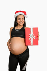 Pregnant woman holding a christmas gift box.