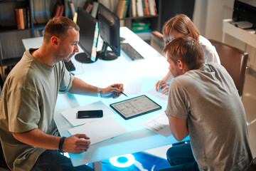 Young creative team of designers developing a new interior project in modern studio