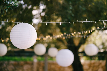 Paper lanterns. A garland of paper balls. - Powered by Adobe