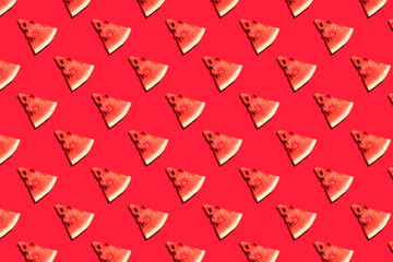 Top view of watermelon slices on red background. Watermelon colorful pattern
