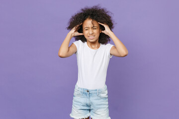 Displeased sick little african american kid girl 12-13 years old in white t-shirt isolated on...