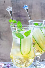 Elderflower and apple juice mocktail with cucumber, mint and ice cubes