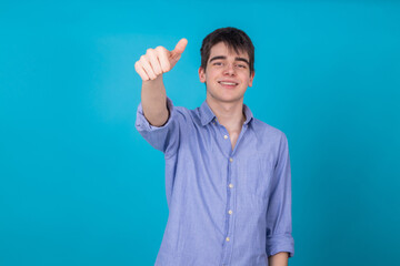 isolated young male teenager with okay sign