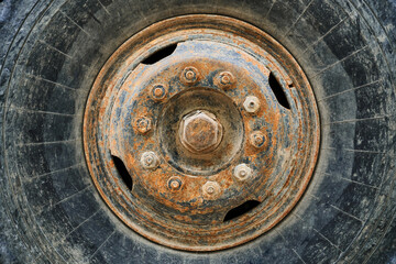 big wheel close view of old tractor as background