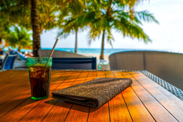 A glass of cold cocktail on a table on the beach in a restaurant. Maldives
