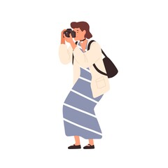 Smiling woman in trendy dress taking photo holding camera vector flat illustration. Happy female photographing enjoying hobby isolated on white. Cute girl amateur photographer with backpack