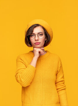 Young Woman In Yellow Outfit And Glasses