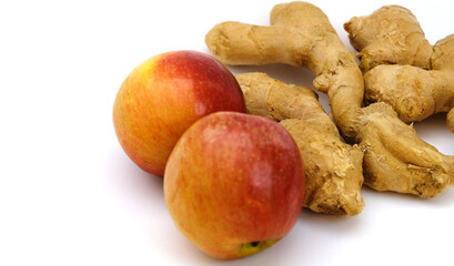 ginger root with apples on white background