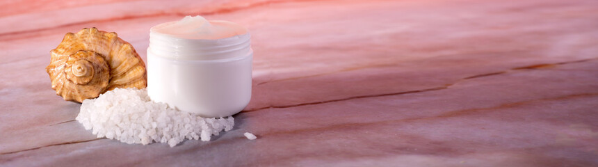 Fototapeta na wymiar Sea Salt Skin Care Cosmetics. Dead sea natural cream on a marble background.